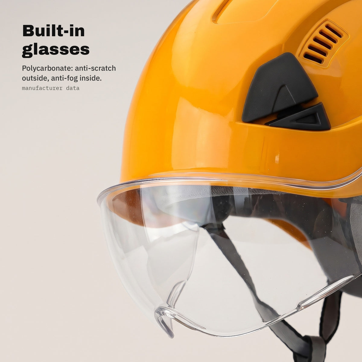 Built-in polycarbonate glasses in the orange safety helmet