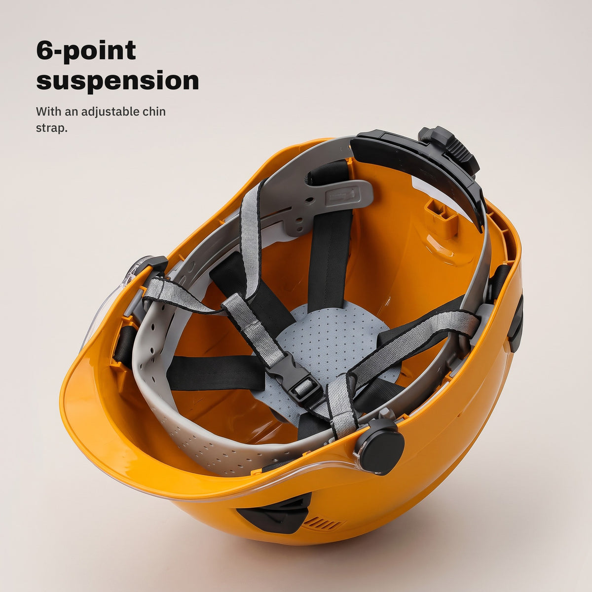 6-point suspension and chin strap of the orange helmet — view from below