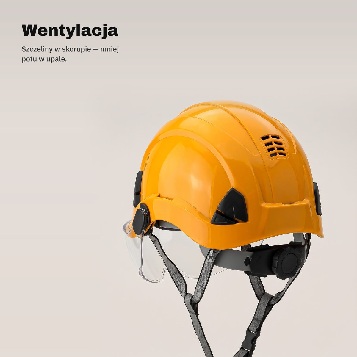 Szczeliny wentylacyjne w skorupie pomarańczowego kasku ochronnego