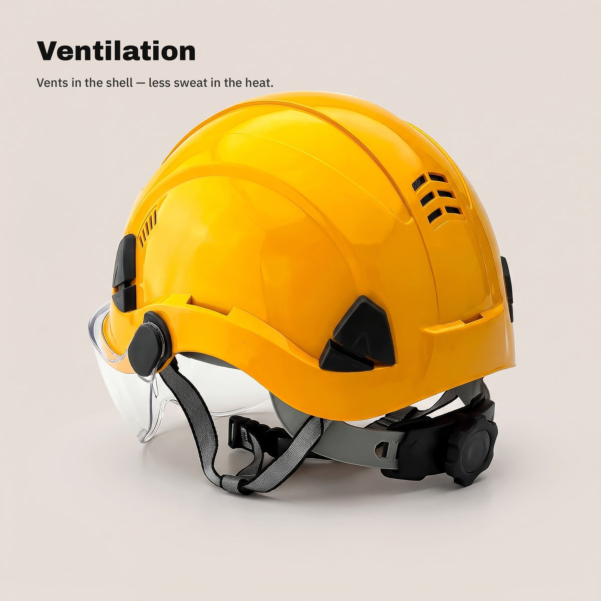 Ventilation slots in the shell of the yellow safety helmet